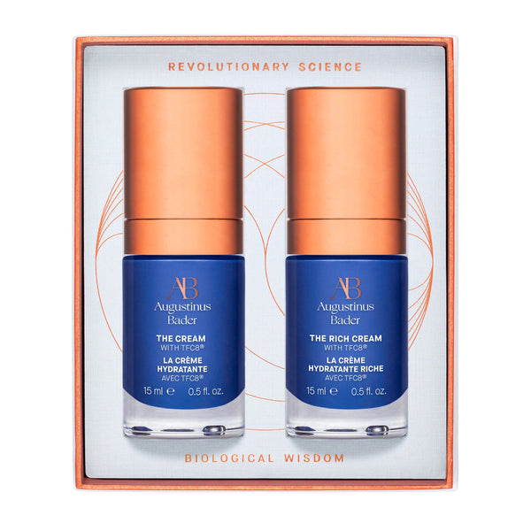 Augustinus Bicker The Cream & Rich Cream set in a square gift box. The set contains two 15 ml bottles of skincare with deep blue labels and metallic copper caps, presented in an orange-bordered white box with gold text.