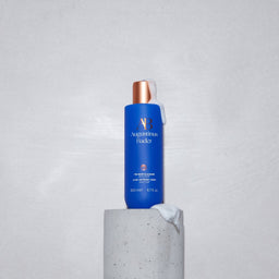 Augustinus Bader The Body Cleanser on top of a pedestal