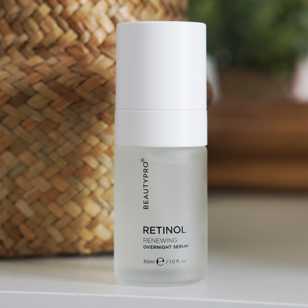BeautyPro Retinol serum bottle on a surface with a woven basket in the background
