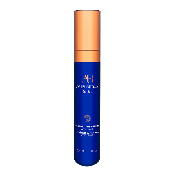 Blue skincare serum bottle with gold cap on a white background