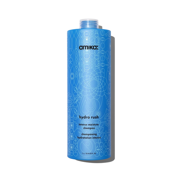 Blue shampoo bottle with 'amika' branding on a white background