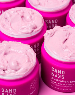 Multiple open tubs of Sand & Sky Australian Emu Apple Super Bounce Mask