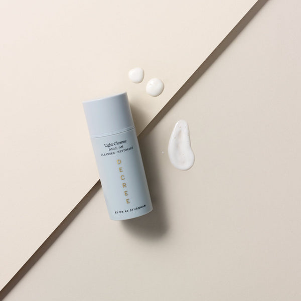 Decree Light Cleanse bottle with three drops of texture