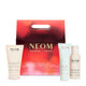 NEOM skincare products including body polish, body cleanser, and body milk with a red box in the background.
