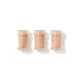 Three small clear plastic jars filled with a light peach-beige powder, arranged side by side on a white background.