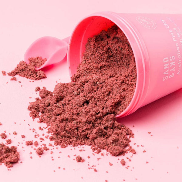 Sand & Sky Australian Pink Clay Smoothing Body Sand bucket tipped over spilling its contents
