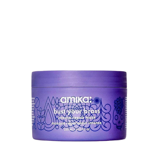 Purple container of amika bust your brass intense repair mask on a white background