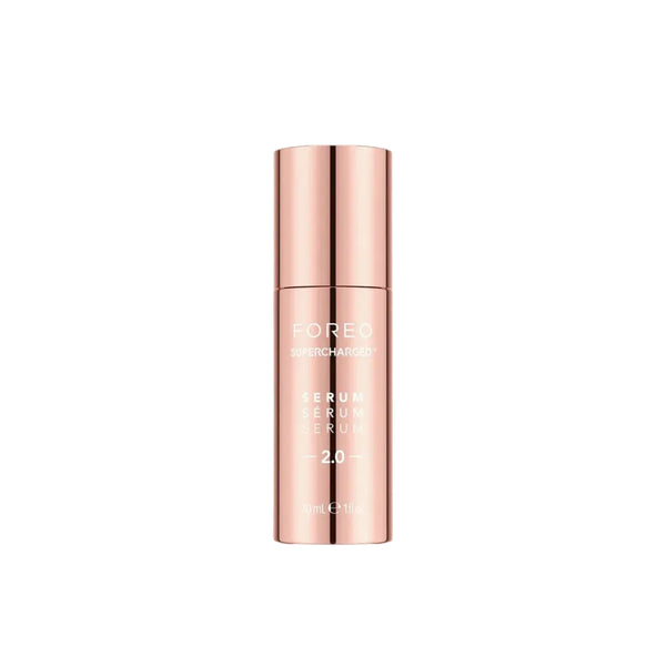 A single bottle of FOREG Skin Treatment Serum 2.0 in a metallic rose gold color, centered on a plain off-white background.