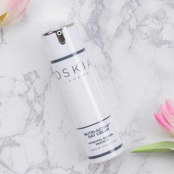 OSKIA Nutri-Active Day Cream Travel on a marble surface