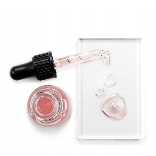 Avant Skincare Rose Radiance & Anti-ageing Hyaluronic Eye Serum  poured onto a slate