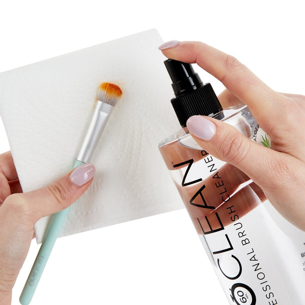 ISOCLEAN Makeup Brush Cleaner With Spray Top being sprayed onto a brush