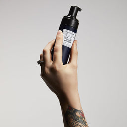 Murdock London Sea Salt Volume Mousse held in the aur