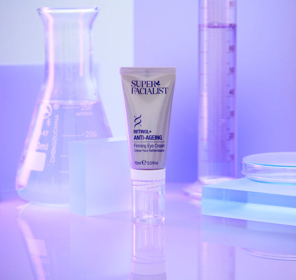 Retinol eye cream tube inside a purple coloured lab