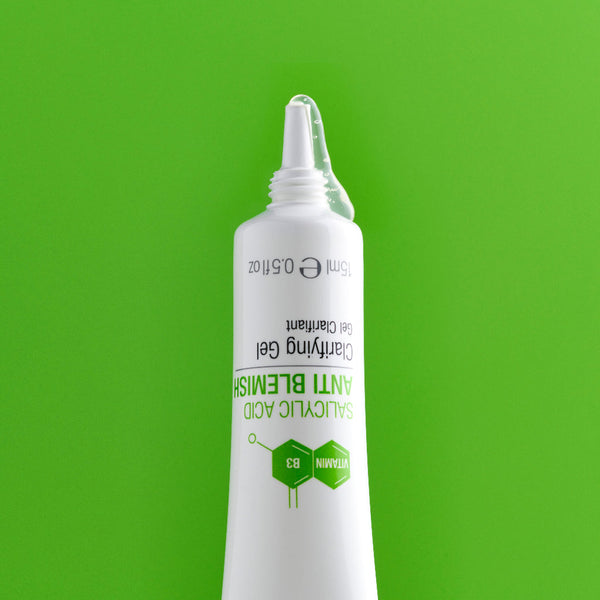 Spot gel emerging from white tube on green background