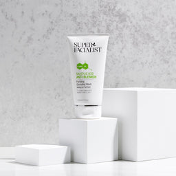 Salicylic acid cleansing wash tube on white cubes against an off white background