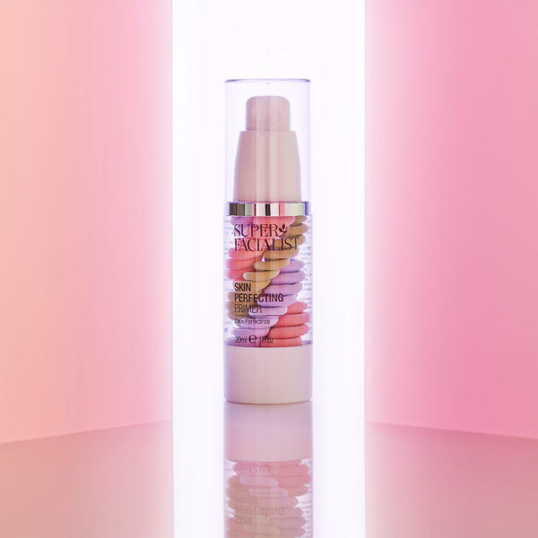 Primer pump bottle emerging from two pink walls