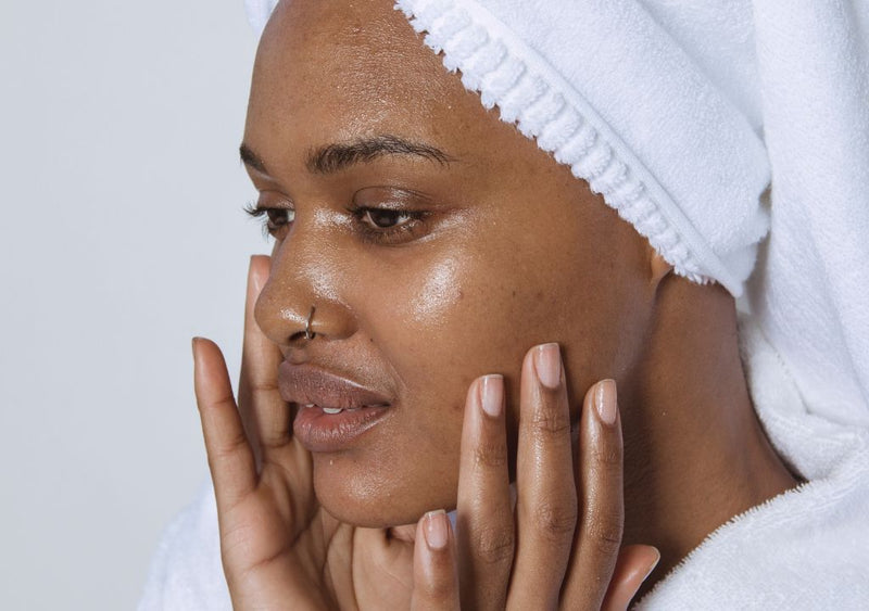 Woman applying Sebamed Clear Face Mattifying Cream to their face