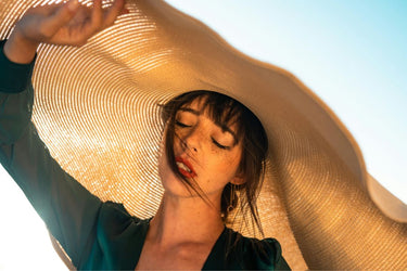 woman wearing a sun hat in the sunshine