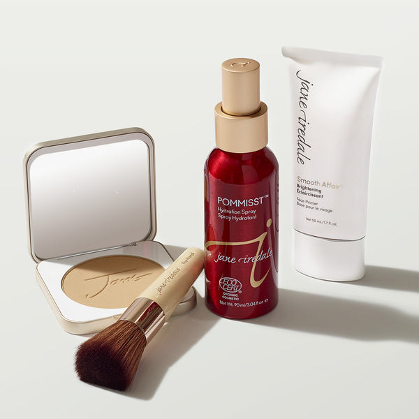 Jane Iredale skincare makeup products arranged with brushes and powders