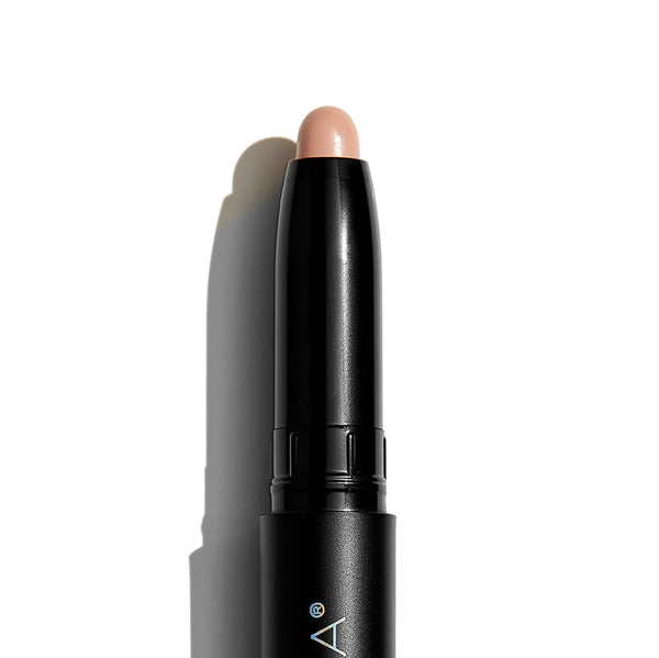 Makeup stick with beige applicator on a white background