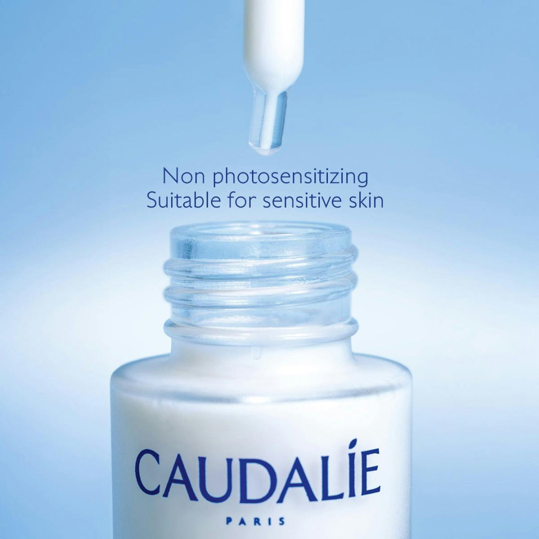 Caudál bottle with dropper on a blue background