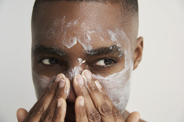 a man applying Decree Deep Cleanse to his face