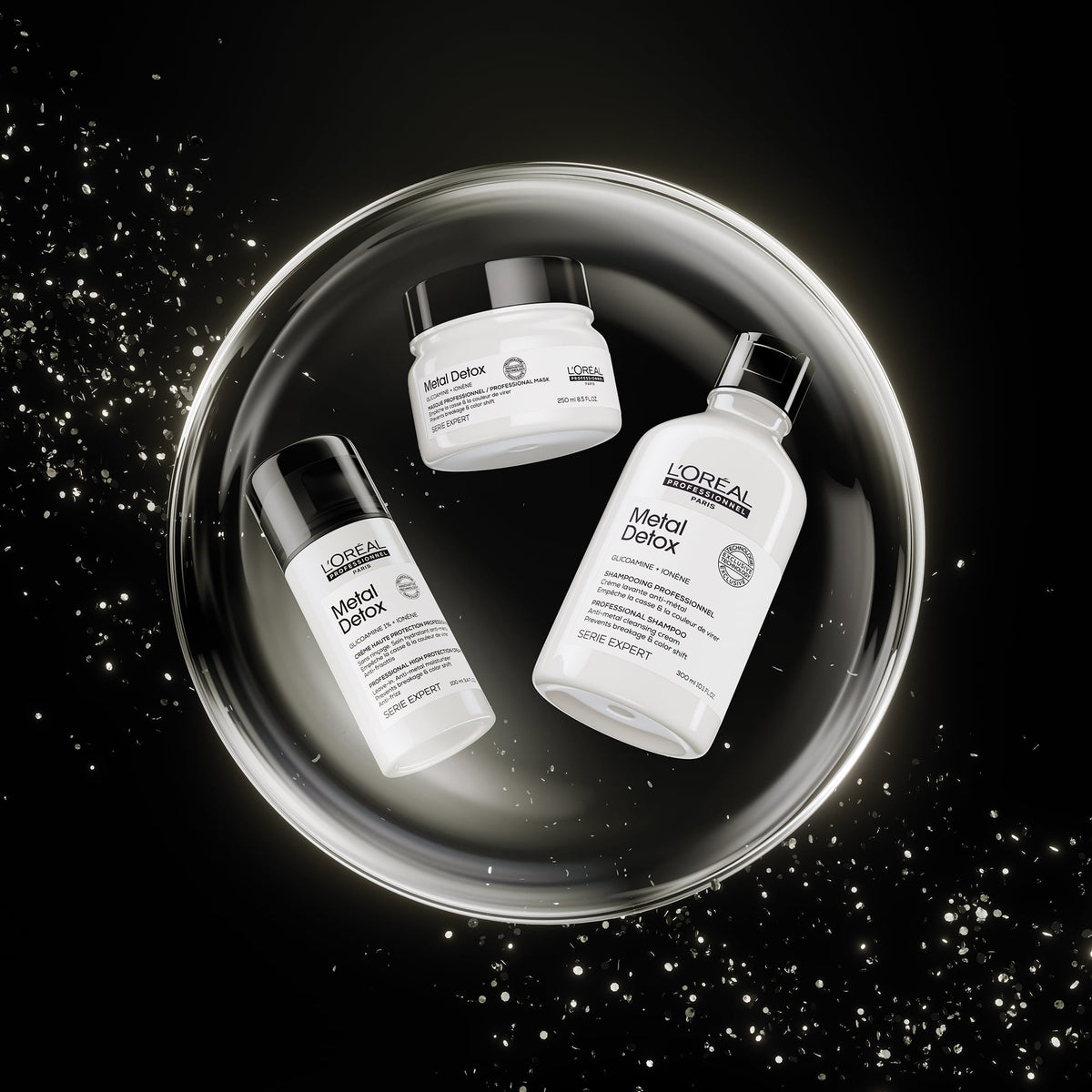 Three L'Oréal Paris Metal Detox skincare products arranged inside a glowing circular metallic tray on a black background with sparkling light effects.