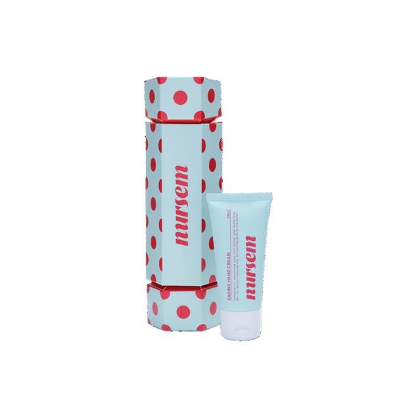 Nursem hand cream 30ml tube next to its matching cylindrical packaging box, both featuring a light blue color with red polka dots and the brand name printed in red.