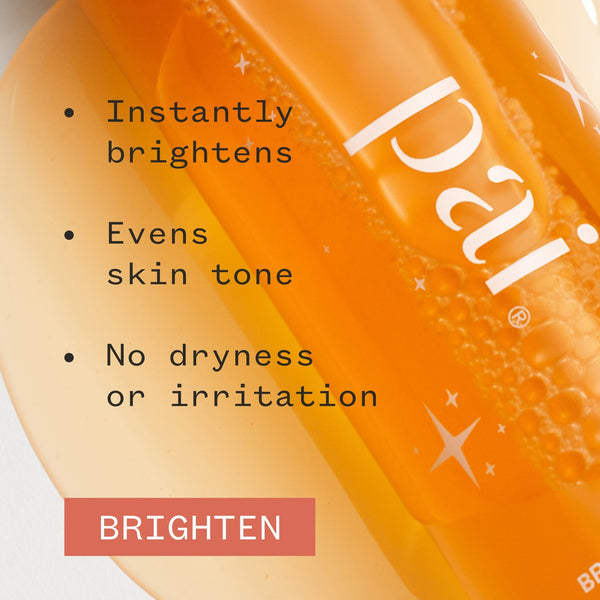 Orange skincare product with text highlighting benefits on a white background