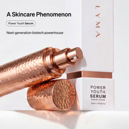 LYMA Power Youth Serum shown with a metallic rose-gold textured spray bottle, its cap placed beside it, and a white rectangular box. Text on the image reads 'A Skincare Phenomenon' and 'Power Youth Serum' with 'LYMA' visible on the packaging.