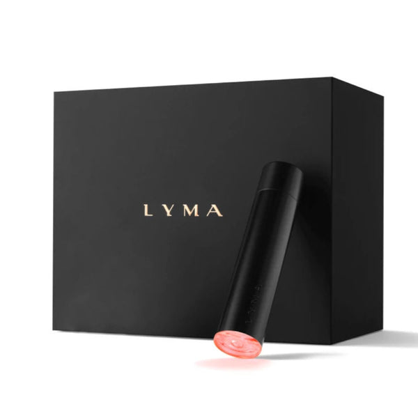 A sleek black Lyma device with a glowing pink tip stands in front of a matte black Lyma box on a clean white background.