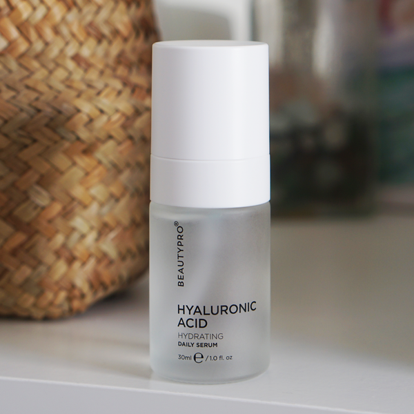 BeautyPro Hyaluronic Acid serum bottle on a surface with a blurred background
