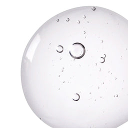 Close-up of a white round object with circular patterns on a white background