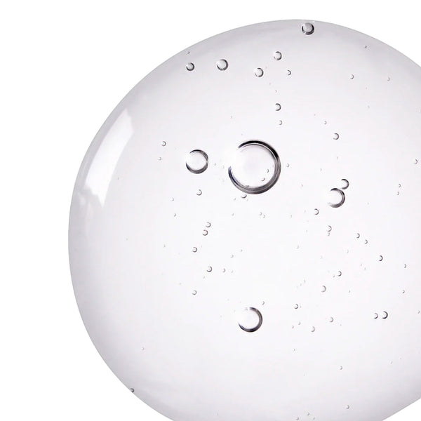 Close-up of a white round object with circular patterns on a white background