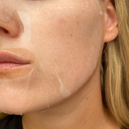 Close-up of a person's face with a beige patch on their cheek