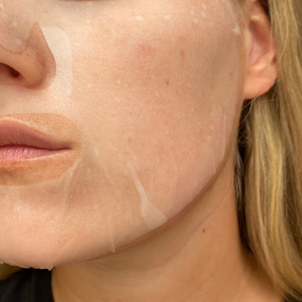 Close-up of a person's face with a beige patch on their cheek