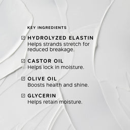 A close-up of a white cosmetic cream with visible texture and printed text listing key ingredients: hydrolyzed elastin, castor oil, olive oil, and glycerin.