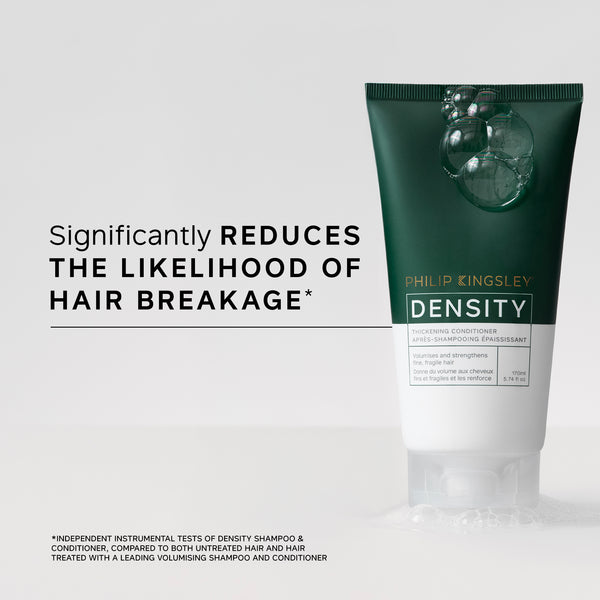 Tube of Philip Kingsley Density product on a light gray background