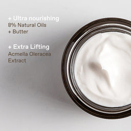 An open jar of white cream or balm on a light gray background with text highlighting ingredients: 'Ultra nourishing 8% Natural Oils + Butter' and 'Extra Lifting Acmella Oleracea Extract'.