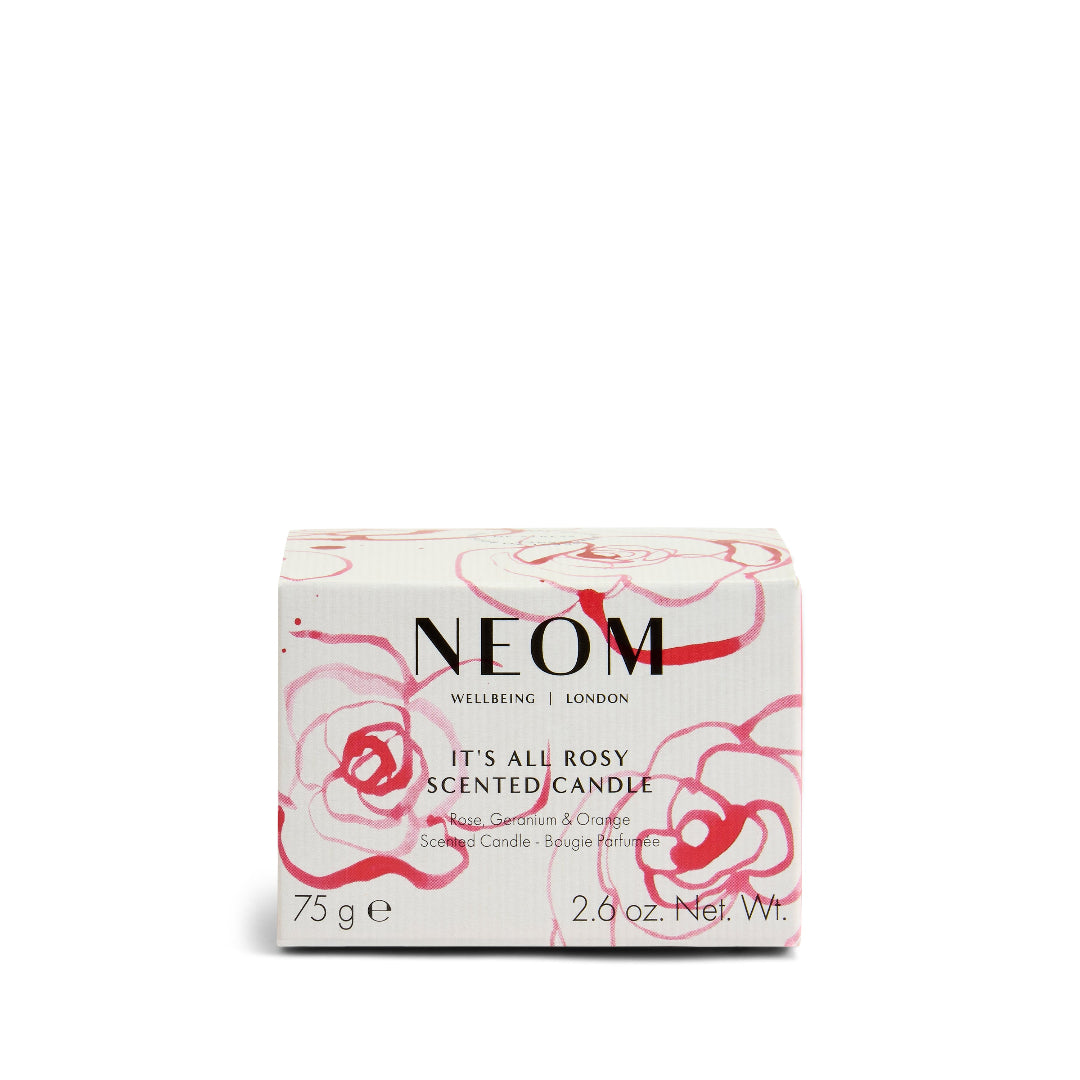 NEOM scented candle packaging with floral design on a white background