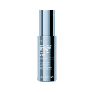 Skincare serum bottle with label on a solid background