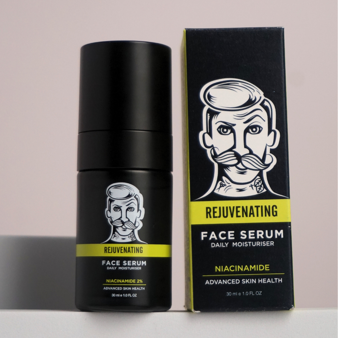 Black face serum bottle and packaging with a stylized face illustration on a light gray background
