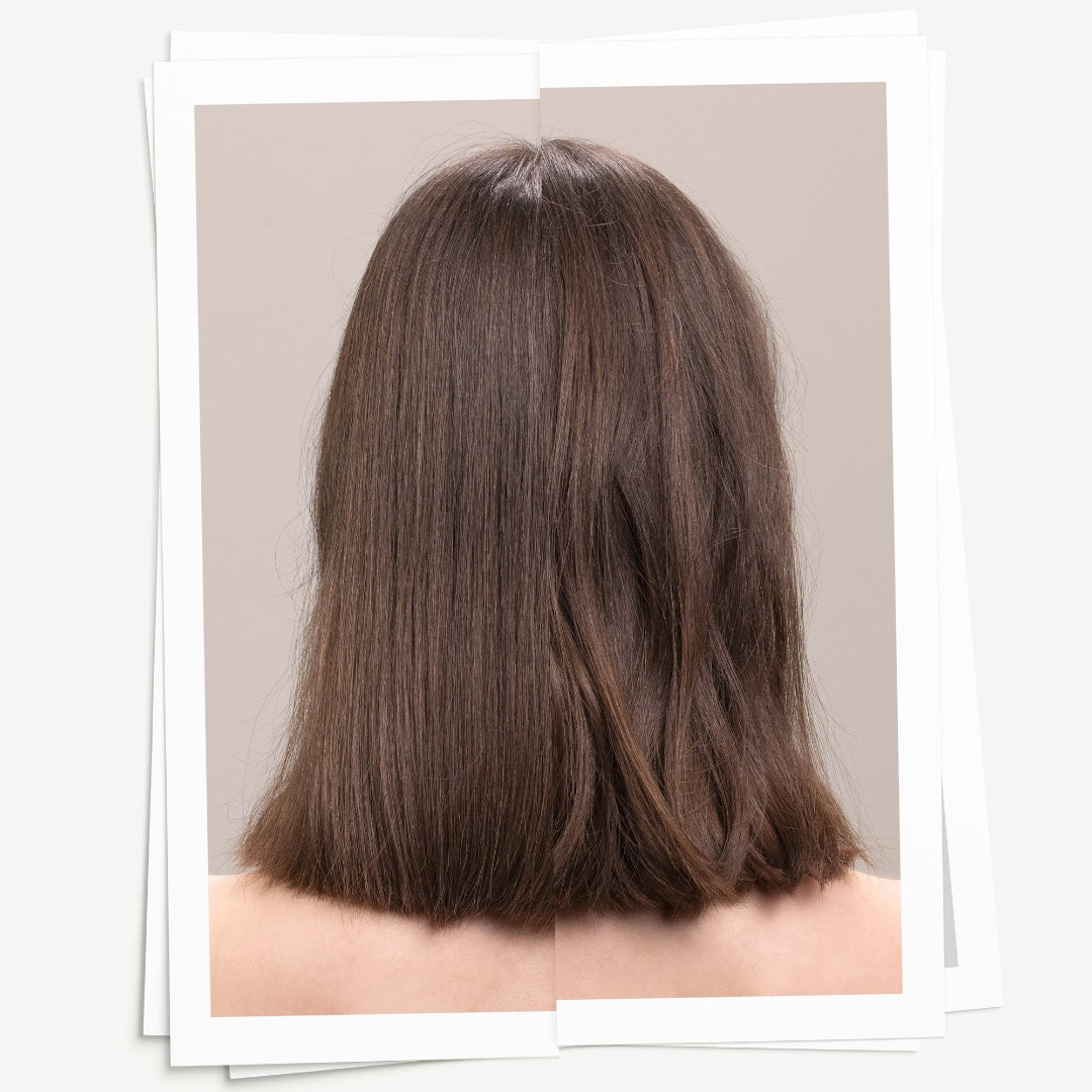 Back view of a person with long, straight brown hair on a neutral background
