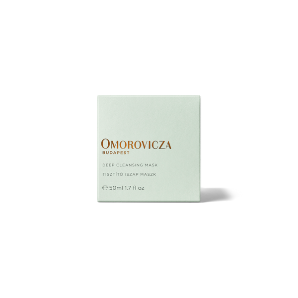 A square pale mint green box of Omorovicza Budapest Deep Cleansing Mask, featuring gold and gray text, centered on a white background with a soft shadow.