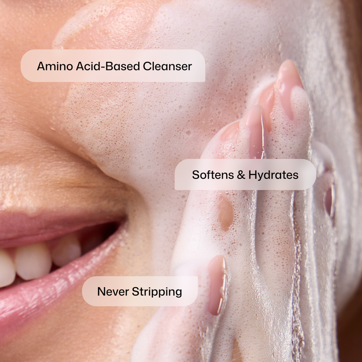 Close-up of a hand applying foam to a face with text indicating product benefits.