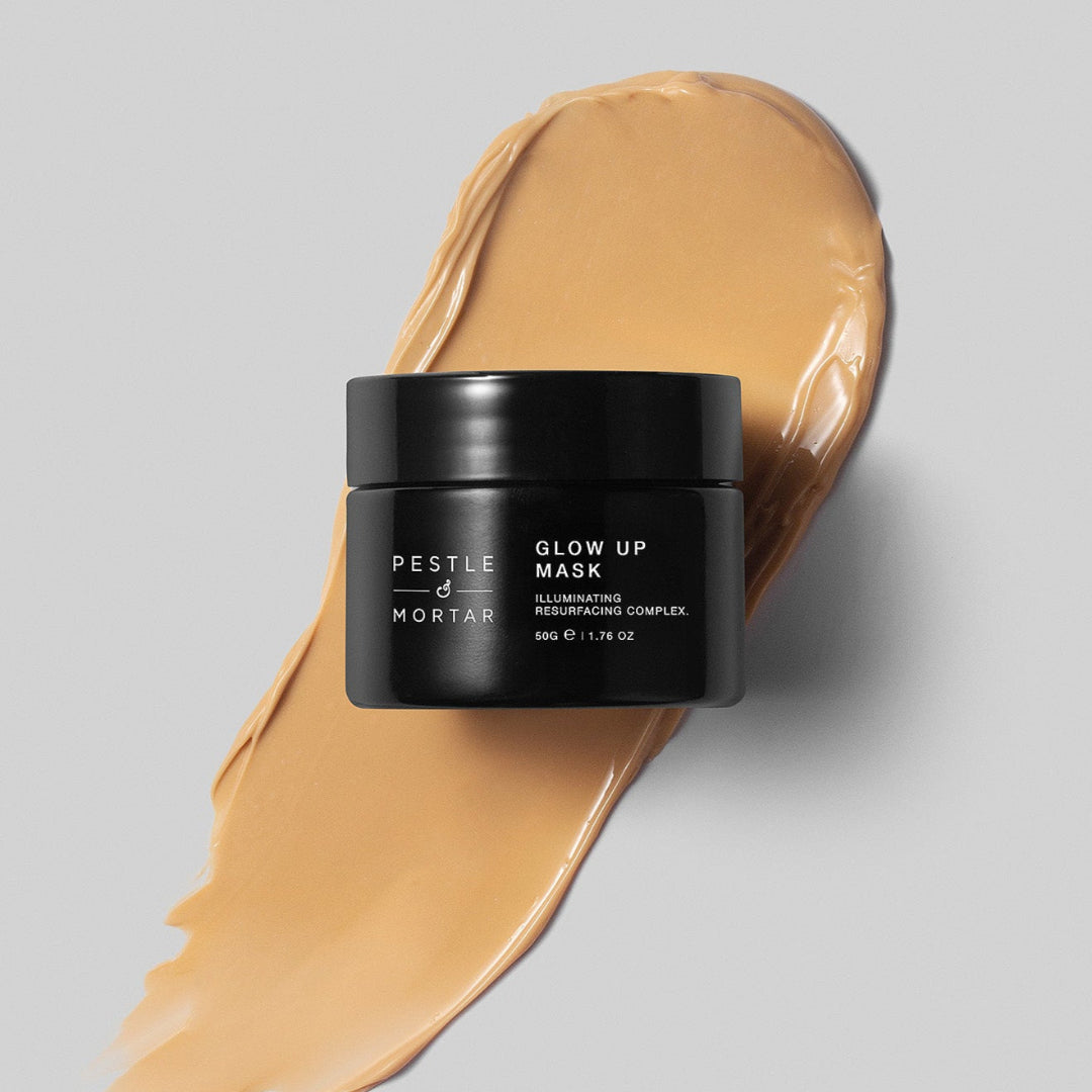 Jar of Pestle & Mortar Glow Up Mask with a swatch of mask on a gray background