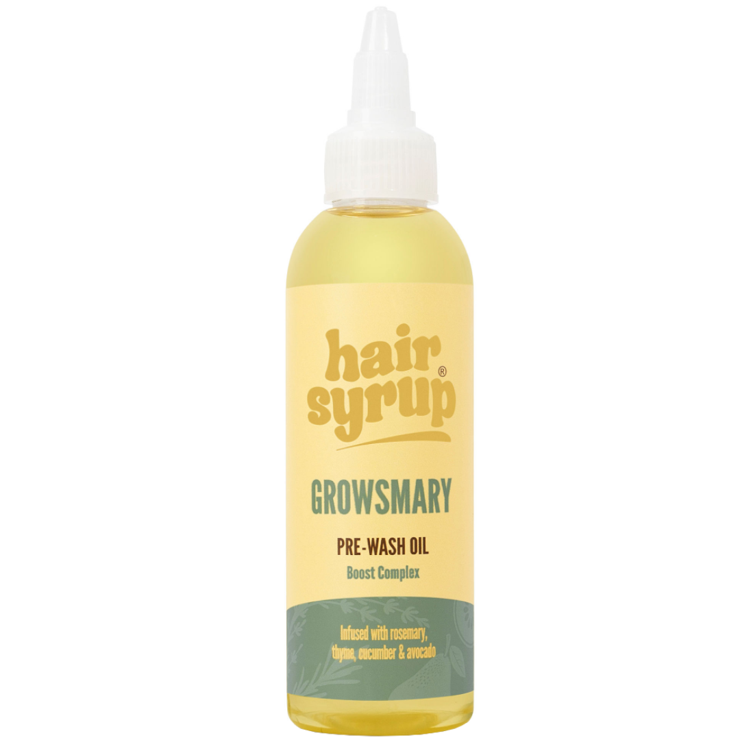 Bottle of hair syrup pre-wash oil with a yellow label on a white background