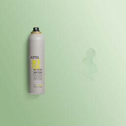 KMS Hair Play spray can on a light green background