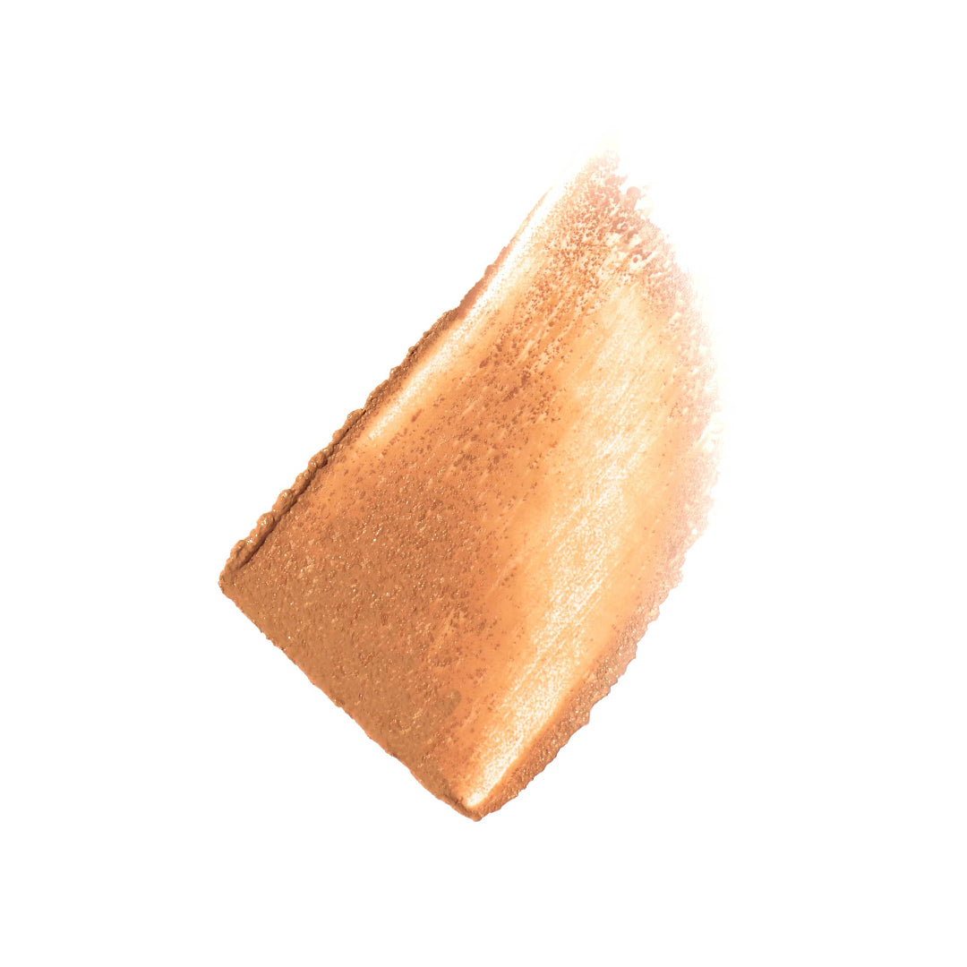 Bronze-colored makeup swatch on a white background