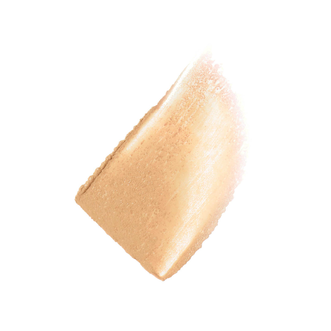 Close-up of a beige makeup product on a white background